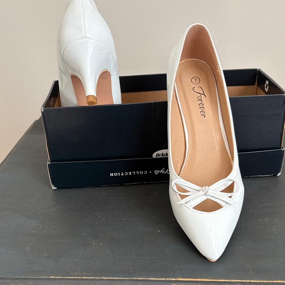 Patent leather Forever 21 Cream Heels with Bow Detail.